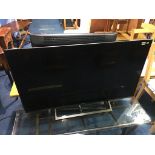 A Sony 49" TV (with remote in office)