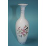 A very fine porcelain Oriental vase, decorated with a bird, 19cm high