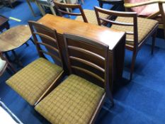 A teak McIntosh drop leaf table and four chairs