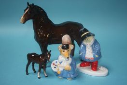 Two Beswick horses and a Coalport 'Paddington' and 'Basil Brush' (4)