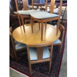 A Danish teak circular table and six chairs