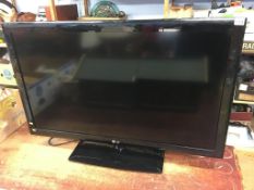 An LG 42" TV (with remote in office)