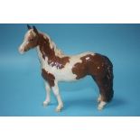 A Beswick piebald brown and white pony