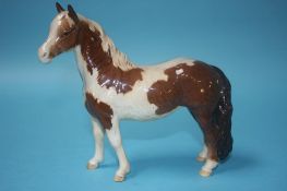 A Beswick piebald brown and white pony