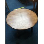 A circular oak coffee table