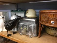 Shelf of assorted including vintage helmet, pot dog, planter etc.