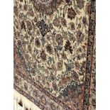 A good quality Persian cream ground rug, 128cm x 110cm