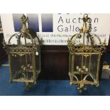 A large pair of brass and glass hanging light fittings, 120cm high x 37cm wide