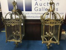 A large pair of brass and glass hanging light fittings, 120cm high x 37cm wide