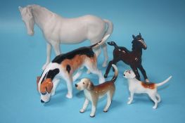 Two Beswick horses, a hound and two other dogs