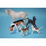 Two Beswick horses, a hound and two other dogs