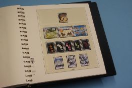 Three stamp albums, Alderney, Jersey and Guernsey