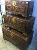 A set of three carved Oriental chests