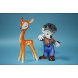 A Goebel model of a fawn and a Goebel model of a boy modelled as a hedgehog with a butterfly on