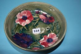 A Moorcroft shallow circular bowl, decorated with anemones, impressed mark, 22cm diameter