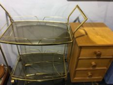 An oak bedside chest and a tea trolley