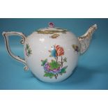 An oversized Herend porcelain teapot, decorated with butterflies and flowers