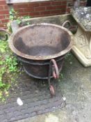 Cast iron bowl on stand and a large vice