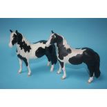 A Beswick 'Pinto Pony', piebald black and white gloss and a matt version (2)
