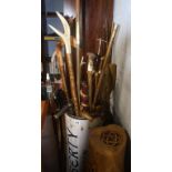 Quantity of walking sticks and canes in a Liberty canister