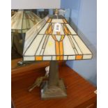 A table lamp, with Tiffany glass style shade