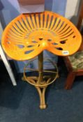 An orange tractor seat bar stool