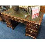 A reproduction mahogany pedestal desk 137cm wide, 69cm deep. 75cm height