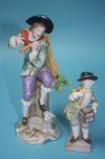 A Continental porcelain figure of a young man playing a flute and a small figure of a boy holding