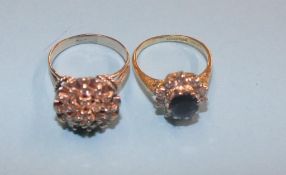 Two rings, one marked '750', the other with rubbed marks