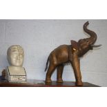 A Phrenologists head and a leather clad elephant