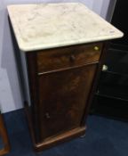 A Victorian mahogany and marble top bedside cabinet