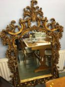 A large decorative and ornate mirror, 166 x 110cm