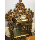 A large decorative and ornate mirror, 166 x 110cm
