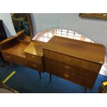 A teak dressing table and a chest of drawers