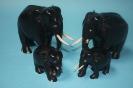 A set of four graduated Ebony elephants