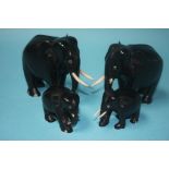 A set of four graduated Ebony elephants