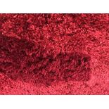 Two large red woolly rugs