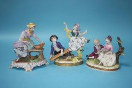 A Continental porcelain group of a boy and girl on a see saw, another of a girl seated collecting