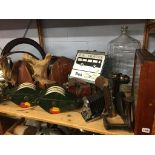 Shelf of assorted including a bowling ball, mirrors etc.