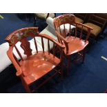 Two orange painted chairs