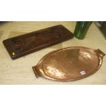 A copper tray and a carved wooden mould