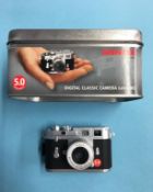 Mini Leica digital camera and box