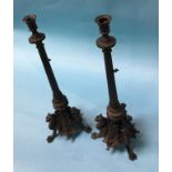 A pair of ornate bronze Empire style candlesticks, decorated with Dragons, 54cm high
