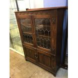 An oak linenfold cabinet