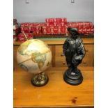 A Spelter figure and a globe