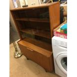 Teak record cabinet and a teak sliding door bookcase