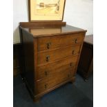 An oak chest of drawers