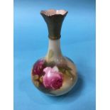 A Royal Worcester vase, decorated with roses, green mark, number G702