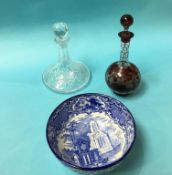 A Cranberry coloured etched decanter, a Ships decanter and an 'Abbey' blue and white bowl (3)