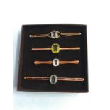 Four 9ct brooches, 12.6g